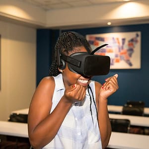 Black woman experiencing VR, South