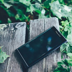 black blackberry priv smartphone on brown board