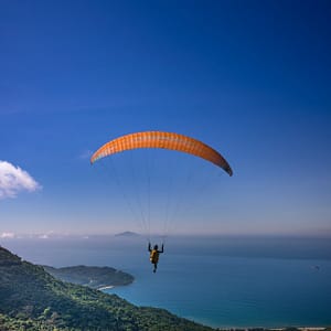 photo of person paragliding