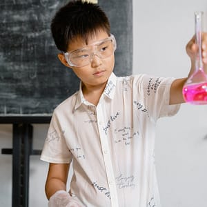 a smart boy doing a science experiment