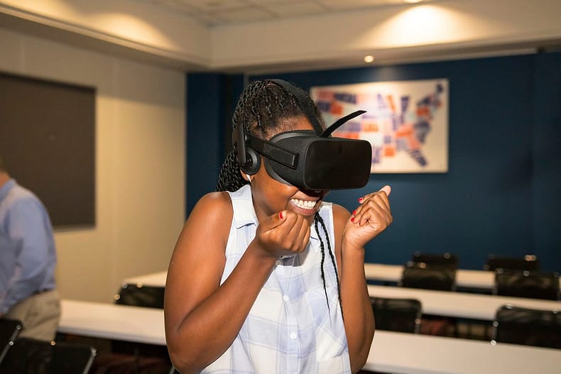 Black woman experiencing VR, South