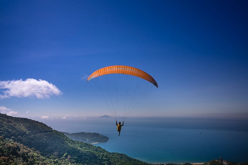 photo of person paragliding